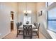 Formal dining room with a large table and chandelier at 4333 W Shaw Butte Dr, Glendale, AZ 85304