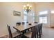 Bright dining room with a large table and chandelier at 4333 W Shaw Butte Dr, Glendale, AZ 85304