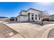 Two-story stucco home with a three-car garage and landscaped front yard at 4333 W Shaw Butte Dr, Glendale, AZ 85304