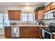 Kitchen with wood cabinets, granite counters, and appliances at 4333 W Shaw Butte Dr, Glendale, AZ 85304