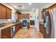 Kitchen with wood cabinets, granite countertops, and stainless steel appliances at 4333 W Shaw Butte Dr, Glendale, AZ 85304