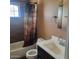 Clean bathroom with shower/tub combo and modern vanity at 4339 W Crittenden Ln, Phoenix, AZ 85031