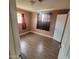 Well lit bedroom with hardwood floors and window coverings at 4339 W Crittenden Ln, Phoenix, AZ 85031