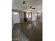 Bright living room featuring hardwood floors and a comfy chair at 4339 W Crittenden Ln, Phoenix, AZ 85031