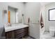 Modern bathroom with a walk-in shower and floating vanity at 4602 E Arcadia Ln, Phoenix, AZ 85018