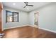 Spacious bedroom with hardwood floors and an ensuite bathroom at 4602 E Arcadia Ln, Phoenix, AZ 85018