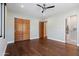 Bright bedroom with wood sliding doors and ensuite bath at 4602 E Arcadia Ln, Phoenix, AZ 85018