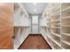 Custom walk-in closet offers extensive storage solutions at 4602 E Arcadia Ln, Phoenix, AZ 85018