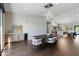 Modern dining room with a large table and hardwood floors at 4602 E Arcadia Ln, Phoenix, AZ 85018