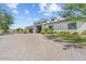 Modern home with stone accents and a spacious driveway at 4602 E Arcadia Ln, Phoenix, AZ 85018