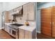 Modern kitchen with stainless steel appliances and wood cabinetry at 4602 E Arcadia Ln, Phoenix, AZ 85018