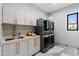 Modern laundry room with washer, dryer, and ample cabinetry at 4602 E Arcadia Ln, Phoenix, AZ 85018