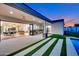 Open-plan living space flows seamlessly into an outdoor kitchen and pool area at 4602 E Arcadia Ln, Phoenix, AZ 85018