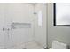 Clean shower with white subway tile and pebble floor at 4602 E Arcadia Ln, Phoenix, AZ 85018