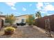 Private backyard with patio furniture and desert landscaping at 4910 S Huachuca Pl, Chandler, AZ 85249