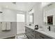 Modern bathroom with double vanity, walk-in shower, and gray cabinets at 4910 S Huachuca Pl, Chandler, AZ 85249