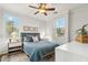 Bright bedroom with a comfortable bed and ceiling fan at 4910 S Huachuca Pl, Chandler, AZ 85249