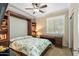 Bedroom with a Murphy bed, built-in shelves, and desk at 4910 S Huachuca Pl, Chandler, AZ 85249