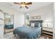 Guest bedroom with full-size bed and mirrored closet at 4910 S Huachuca Pl, Chandler, AZ 85249