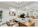 Bright home office with wood desk and hardwood floors at 4910 S Huachuca Pl, Chandler, AZ 85249