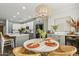 Bright kitchen with a round dining table and modern light fixture at 4910 S Huachuca Pl, Chandler, AZ 85249