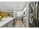 Modern kitchen with gray cabinets, white upper cabinets, and stainless steel appliances at 4910 S Huachuca Pl, Chandler, AZ 85249