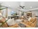 Living room with a modern fireplace and large TV at 4910 S Huachuca Pl, Chandler, AZ 85249