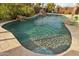 Relaxing pool with a mosaic tile design and waterfall at 4910 S Huachuca Pl, Chandler, AZ 85249