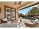 Relaxing poolside patio with seating and access to the pool at 4910 S Huachuca Pl, Chandler, AZ 85249