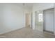 Carpeted bedroom with mirrored closet doors and window at 4933 E Meadow Mist Ln, San Tan Valley, AZ 85140