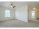 Bedroom with ceiling fan and access to another bedroom at 4933 E Meadow Mist Ln, San Tan Valley, AZ 85140