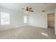 Bright bedroom with ceiling fan and large closet at 4933 E Meadow Mist Ln, San Tan Valley, AZ 85140