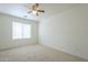 Spacious bedroom with ceiling fan and window blinds at 4933 E Meadow Mist Ln, San Tan Valley, AZ 85140