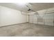 Garage with automatic door opener and concrete floor at 4933 E Meadow Mist Ln, San Tan Valley, AZ 85140