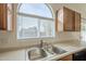 Modern kitchen sink with stainless steel double basin and window at 4933 E Meadow Mist Ln, San Tan Valley, AZ 85140