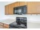 Black electric cooktop and microwave in the kitchen at 4933 E Meadow Mist Ln, San Tan Valley, AZ 85140