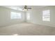 Main bedroom with ceiling fan and multiple windows at 4933 E Meadow Mist Ln, San Tan Valley, AZ 85140