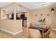 Dining area features a wooden table and chairs near the kitchen at 5138 N 78Th St, Scottsdale, AZ 85250