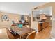 Bright dining area with a wooden table and chairs, adjacent to the kitchen at 5138 N 78Th St, Scottsdale, AZ 85250