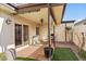 Relaxing patio with seating area and artificial turf at 5138 N 78Th St, Scottsdale, AZ 85250