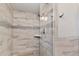 Clean shower with tile surround and glass enclosure at 5138 N 78Th St, Scottsdale, AZ 85250