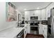 Modern kitchen with white cabinets and quartz countertops at 533 W Guadalupe Rd # 1069, Mesa, AZ 85210