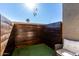 Private patio with artificial turf and wooden privacy wall at 533 W Guadalupe Rd # 1069, Mesa, AZ 85210