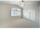 Bright bedroom with vaulted ceiling, shutters, and double doors at 5345 E Mclellan Rd # 98, Mesa, AZ 85205