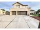 Two-story home with modern garage doors and landscaping at 5345 E Mclellan Rd # 98, Mesa, AZ 85205