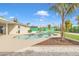 Inviting kidney-shaped pool with surrounding landscaping at 557 S Visalia St, Mesa, AZ 85202