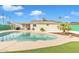 Relaxing pool area, partially covered patio, and solar panels at 557 S Visalia St, Mesa, AZ 85202