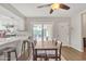 Bright dining area with wood table and chairs, adjacent to the kitchen and patio at 557 S Visalia St, Mesa, AZ 85202