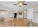 Bright dining area with wood table and view into living room at 557 S Visalia St, Mesa, AZ 85202