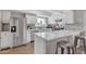 Modern kitchen featuring white shaker cabinets, quartz countertops, and stainless steel appliances at 557 S Visalia St, Mesa, AZ 85202